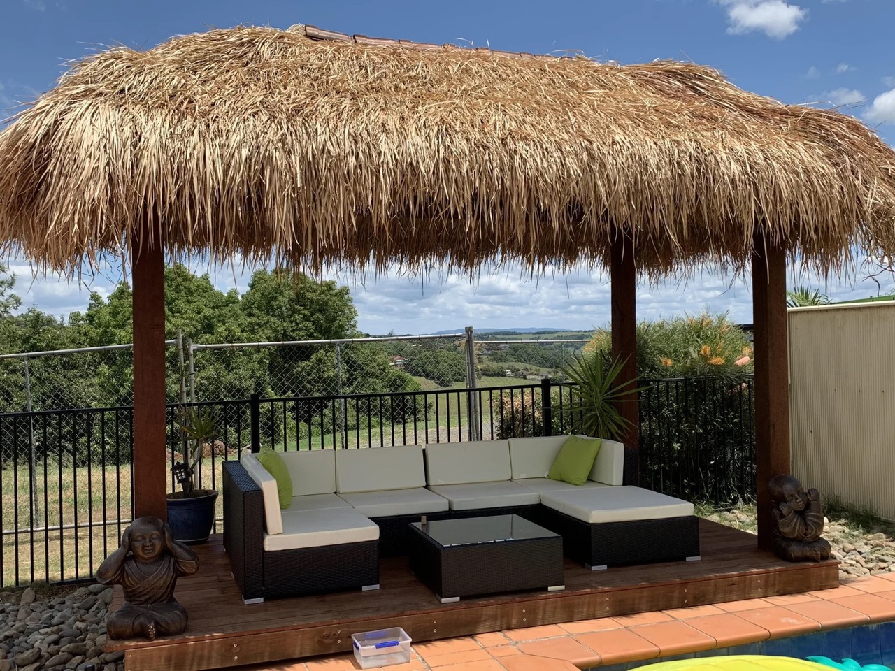 Custom Alang Alang Bali hut over an outdoor lounge with a sweeping view, built by Tropical Gazebos in Sydney